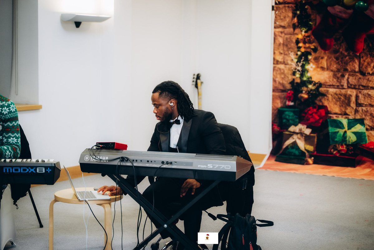 Keyboard player at a carol evening