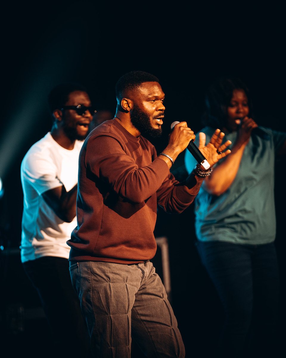 Worship leader singing with the vocalists
